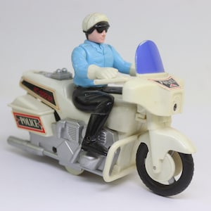 vintage police highway patrol motorbike toy. friction retro collectible figurine