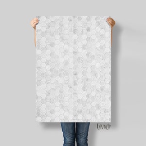 May include: White peel and stick wallpaper with a hexagonal tile pattern. The tiles have a wood grain texture.