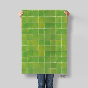 Op de afbeelding: Een rechthoekig paneel van vierkante groene tegels met witte voeglijnen. De tegels variëren in groentinten, waardoor een textuur ontstaat. De tekst "lovaco" staat in de rechterbenedenhoek.