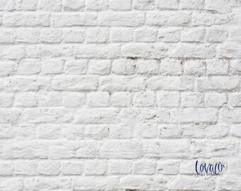 May include: White brick wall texture background. The wall is made of white bricks with a rough surface. The bricks are arranged in a staggered pattern. The wall is a great backdrop for photography or design projects.