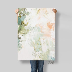 May include: Abstract art print with a white background and brushstrokes in shades of green, blue, and peach. The print has the artist's signature "Lovalo" in the bottom right corner.