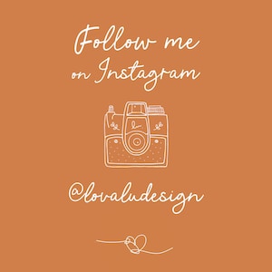 May include: A white outline of a vintage camera with the text "Follow me on Instagram @lovaludesign" and a heart at the bottom.
