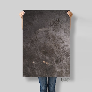 May include: A dark gray textured background with a subtle pattern of lines and scratches. The background has a slightly metallic sheen.