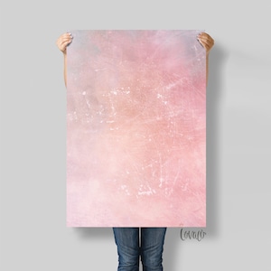 May include: A pink and blue watercolor background with a distressed texture. The background is a light pink with a darker pink and blue overlay. The texture is a subtle, distressed look.
