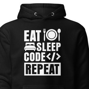 May include: Black hoodie with white text that reads "Eat Sleep Code Repeat" with a fork, plate, spoon, bed, and angle brackets.