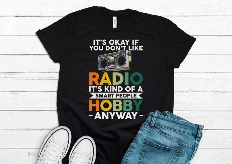 May include: Black t-shirt with a vintage-style boombox graphic and the text "It's okay if you don't like radio. It's kind of a smart people hobby - anyway -."
