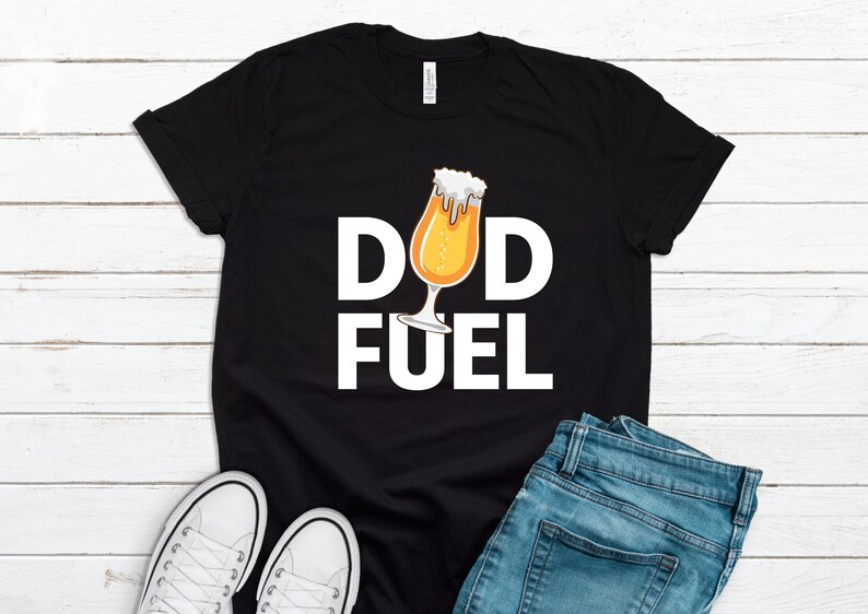 May include: Black t-shirt with white text that reads "Dad Fuel" and a cartoon image of a beer glass.