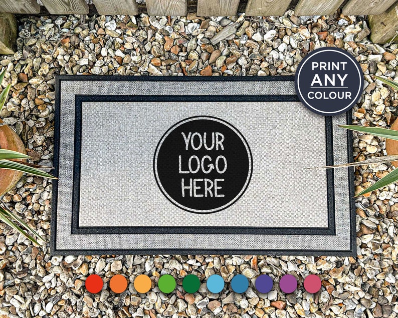 a black and white door mat with a black circle and your logo here on it