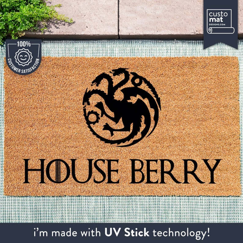 a door mat with a house berry logo on it