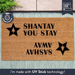 a door mat that says shantay you stay away