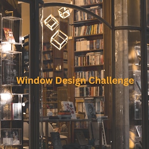May include: A storefront window display featuring the text The Lantern & Leaf Window Design Challenge A STEM Engineering Challenge for 5th-8th Graders. The interior shows tall wooden bookshelves filled with books and three illuminated cube lights.