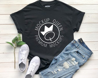 May include: Black t-shirt with a white circle design that says "Mockup Queen Premium Mockups" with a crown and a letter Q inside the circle.