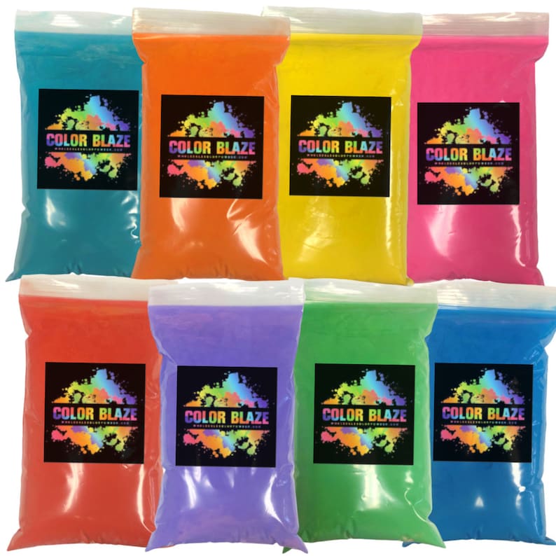 May include: Eight resealable plastic bags filled with colorful powder. The bags are labeled with the words 'COLOR BLAZE'.