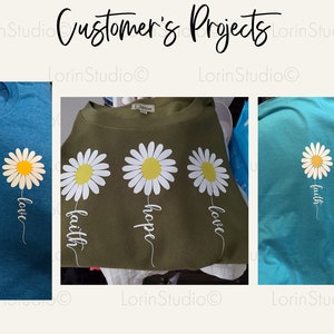 May include: Three t-shirts with a daisy design and the words "faith", "hope", and "love" printed on them. The shirts are in blue, green, and turquoise.