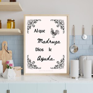 May include: Black and white printable wall art with a rooster illustration and the Spanish proverb "Al que madruga Dios le ayuda." The proverb translates to "The early bird gets the worm."