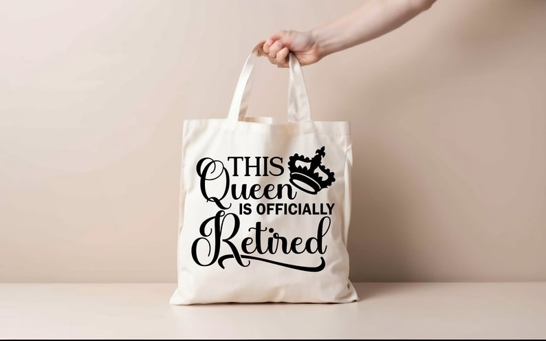 May include: White canvas tote bag with black text that reads "This Queen is Officially Retired" and a black crown graphic.