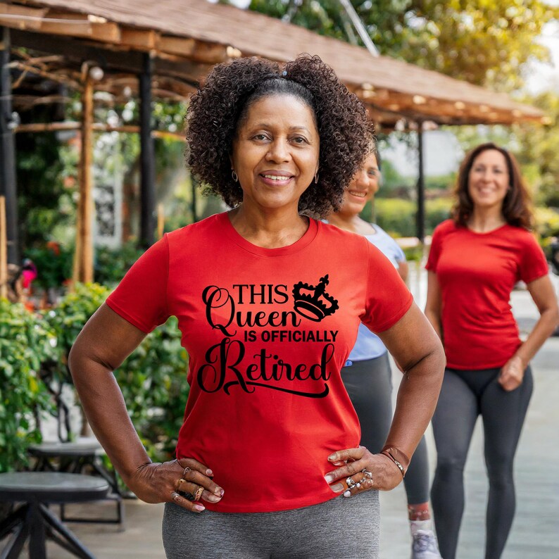 May include: A red t-shirt with black text that reads "This Queen is Officially Retired" and a crown graphic.