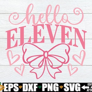 May include: A pink graphic design on a white wood-grain background. The design features the words "hello ELEVEN" in a script font, a bow, and hearts. Below the design are file type icons: EPS, DXF, PNG, and SVG.
