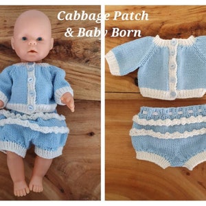 May include: A blue knitted doll outfit with a cardigan and bloomers. The cardigan has white trim and buttons. The bloomers have white lace trim. The outfit is for a Cabbage Patch & Baby Born doll.