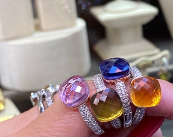 Shiny colored solitaire rings in 925 silver with cushion faceted stone