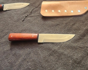 Bluff #1 knife, African red paduak wood handle. Frontier style sheath