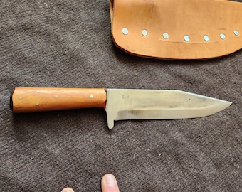 Raptor #4 , osage orange or bodart wood . Frontier style sheath