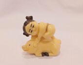 Vintage netsuke, boy on pig