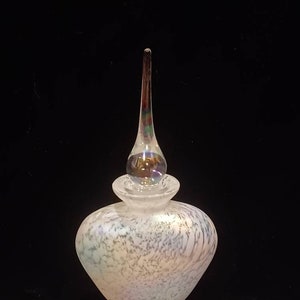 Handmade vintage glass perfume bottle. Clear and white glass with iridescent finish