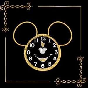May include: Embroidered design of a clock with Mickey Mouse ears, featuring a black face with white numbers and a smiling face. The clock is framed in gold, set against a black background with gold decorative corners.