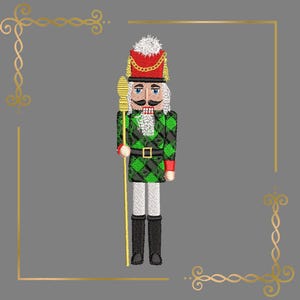 May include: An embroidered nutcracker figure wearing a red hat with a white pom-pom, a green and black plaid jacket with a black belt, white trousers, and black boots. The figure holds a tall gold staff and features a white beard and mustache.