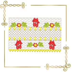 Könnte beinhalten: Ein rechteckiges Stoffpaneel mit weißem Hintergrund und einem wellenförmigen braunen Stichmuster. Das Design zeigt gestickte rote Ballettschuhe, grüne Blätter und gelbe Blumen, akzentuiert durch gelbe horizontale Bänder und einen gezackten Rand.