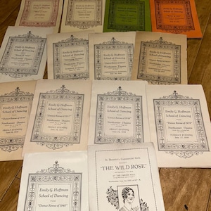 May include: A selection of vintage dance programmes and playbills. The programmes feature the text "Emily G. Hoffman School of Dancing" and "Dance Revue" dates from the 1930s and 1940s. One playbill is for "The Wild Rose" performance.