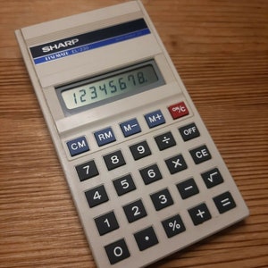 Vintage 1980s Sharp electronic calculator Elsi Mate EL-230. Made in Japan.