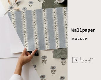 May include: A selection of wallpaper samples in different patterns and colours. One sample shows vertical blue stripes with a floral lace design. Other samples feature floral and geometric patterns. The text "Wallpaper Mockup" is visible.
