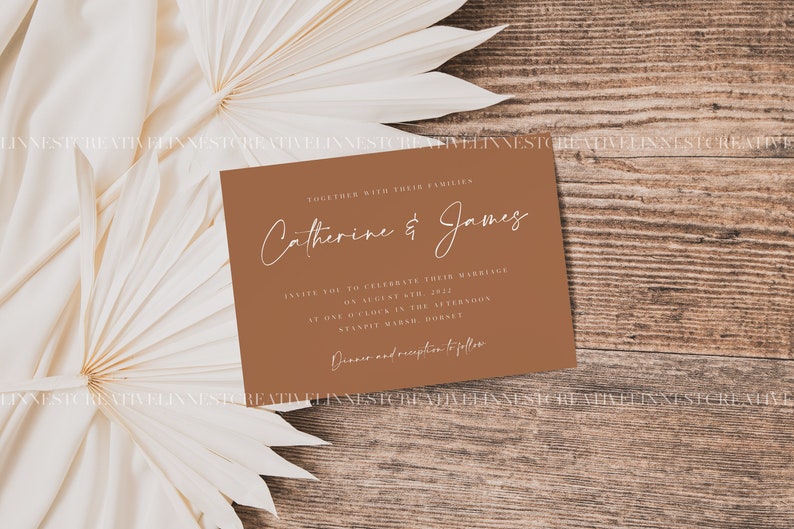 May include: A brown wedding invitation card with white text. The text reads "Together with their families, Catherine & James. Invite you to celebrate their marriage on August 6th, 2022, at one o'clock in the afternoon at Stanpit House, Horsey. Dinner and reception to follow."