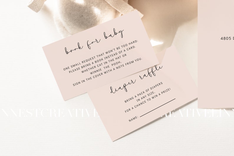 May include: Two pink cards with black text. The top card says "book for baby" and has instructions for guests to bring a book instead of a card. The bottom card says "diaper raffle" and has instructions for guests to bring a pack of diapers for a chance to win a prize.