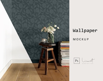 May include: A room corner with dark grey floral wallpaper. A small wooden stool supports a vase of white flowers and a teacup. The floor is made of light brown wooden planks. The text "Wallpaper MOCKUP" is displayed on the right.