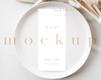 May include: A white card mockup with the text "Limnest Creative" and "4 x 9" on a white plate. The card is on a white surface with a dried flower arrangement in the background.