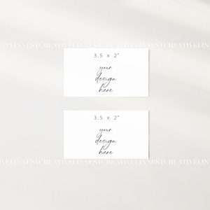 May include: Two blank white cards, each measuring 3.5 inches by 2 inches, with the text "your design here" written in black cursive on each card.