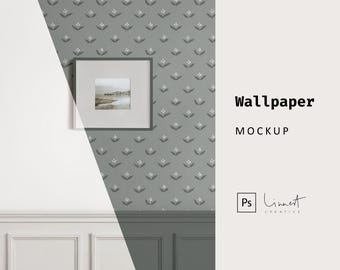 May include: A mockup of a wallpaper with a repeating pattern of small white flowers on a grey background. A black picture frame with a landscape photo is hanging on the wall.