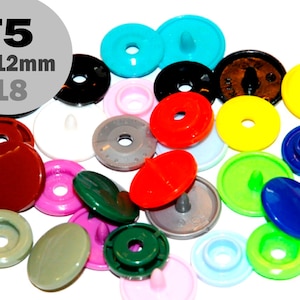 May include: Assortment of colourful plastic snap buttons in various sizes, including red, blue, green, yellow, and brown. The buttons are labelled "T5 10-12mm "18"