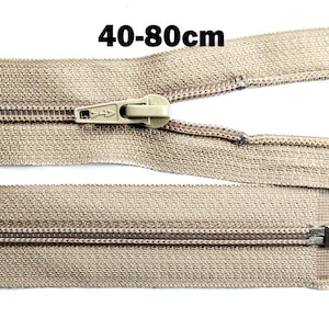 May include: A tan-coloured zipper with a matching pull tab. The zipper is open, showing the teeth and fabric tape. The text "40-80cm" is displayed above the zipper. This zipper is suitable for various sewing projects.