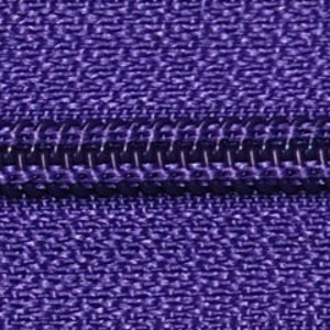 May include: Close-up of a purple zipper with a black zipper pull.