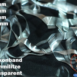May include: Clear elastic bands in various sizes, including 4mm, 5mm, 6mm, and 10mm. The text "Silikonband Gummilitze transparent" is visible in the image.