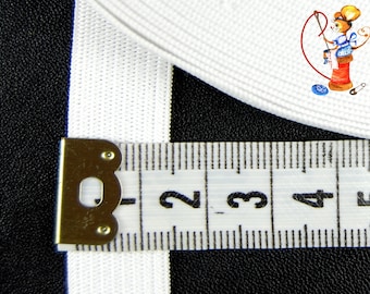 May include: White elastic trim with a measuring tape showing 2 to 5 inches. The elastic is 1/2 inch wide.