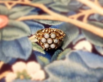 A Sizeable 9ct Gold Studded Ring with 7 Cabochon Opals UK Size O, US Size 7.5