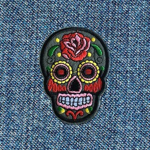 May include: Embroidered grey sugar skull patch with a pink and red rose, black eyes, and colourful details.