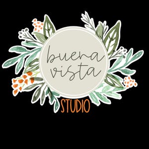 May include: A circular logo with the words "buena vista" in a handwritten font, surrounded by watercolor-style green leaves and orange flowers. The word "STUDIO" is in orange below the circle, all on a black background.