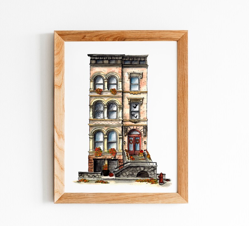 May include: A watercolor painting of a three-story brownstone building with a red door and a stone stoop. The building has a cream-colored facade with brown trim and windows. There are fall leaves on the ground in front of the building.