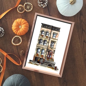 May include: A watercolor illustration of a three-story brownstone building with a red door and a brick facade. The building has windows with white trim and a small stoop with a stone railing. There are potted plants and flowers in front of the building.